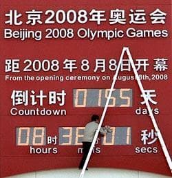 A Chinese worker cleans the Beijing Olympic countdown digital clock on display outside the national museum near the Tiananmen Square in Beijing, China, Thursday, March 6, 2008. Finishing touches on the centerpiece venue of the Beijing Olympics are taking longer than expected, delaying completion by a month, a state-run newspaper reported Thursday. Preparations for the opening and closing ceremonies of the games have interrupted work at the "Bird's Nest" National Stadium, and it will not be completed until the end of April, the China Daily said, citing Jiang Xiaoyu, executive vice president of the Beijing Olympics organizing committee. (AP Photo/Andy Wong)