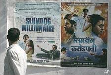 A man walks past a poster of "Slumdog Millionaire," posted on a wall in Mumbai, India, Tuesday, Jan. 13, 2009. India's movie-mad millions have not yet seen "Slumdog Millionaire," but this Mumbai-based fairy tale, which opens here next week, is already the toast of Bollywood. On Sunday, "Slumdog?, with its cast of actors unknown outside India and its story set on the gritty streets of Mumbai, went home with four Golden Globe awards, and became the movie to beat at the Academy Awards. (AP)