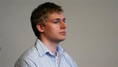 Boston University medical student Philip Markoff stands during his arraignment in Boston Municipal Court, Tuesday, where he pleaded not guilty to charges of murder and armed robbery. (AP Photo)