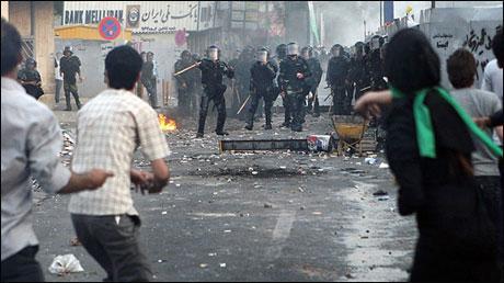 In this photograph posted on the internet, Iranian riot police clash with demonstrators Saturday in Tehran. (AP Photo)