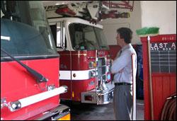 Chelsea City Manager Jay Ash looks over the cramped fire station he would like to rebuild. (Fred Thys/WBUR)
