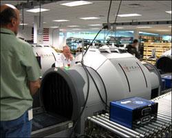 The Bedford company Reveal scored a contract for baggage scanners as a result of federal stimulus funding. (Fred Thys/WBUR)