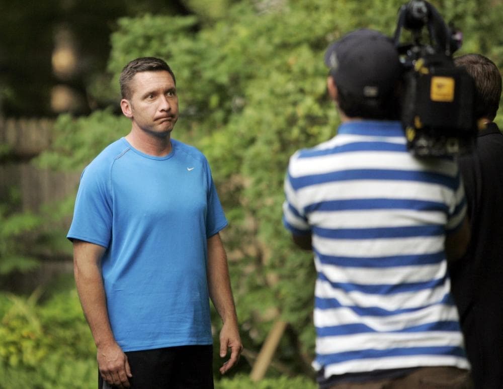 Cambridge Police Sgt. James Crowley listens to questions from members of the media at his home in Natick, Mass., the day after he arrested black Harvard scholar Henry Louis Gates Jr. on disorderly conduct charges. (AP Photo)