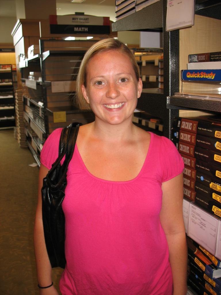 Suzanne Salter is a former Navy veteran who is studying to be a nurse at UMass Boston.  She's shopping for books, which can run hundreds of dollars for one class.  (Photo by WBUR)
