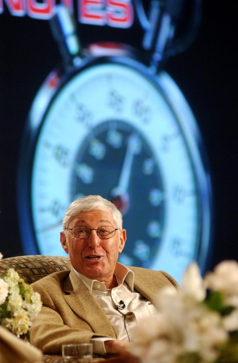 Against a backdrop of the famous "60 Minutes" stop watch, Don Hewitt, the program's creator and executive producer, answers questions about the show during a session on "60 Minutes" during CBS' Winter Press Tour, Saturday, Jan. 17, 2004, in the Hollywood section of Los Angeles.   (AP Photo/Rene Macura)
