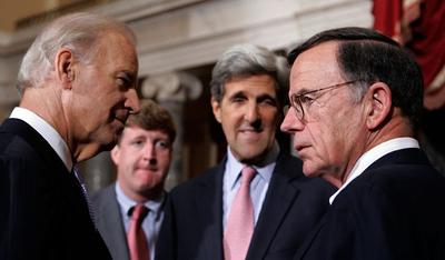 Biden talks with the newly sworn-in Kirk as the late Sen. Edward M. Kennedy's son, Rep. Patrick Kennedy, and Sen. John Kerry look on. (AP)