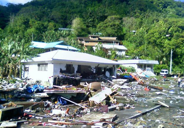 Devastation on a hillside in Pago, American Samoa after tsunami waves swept ashore early Tuesday. (AP)