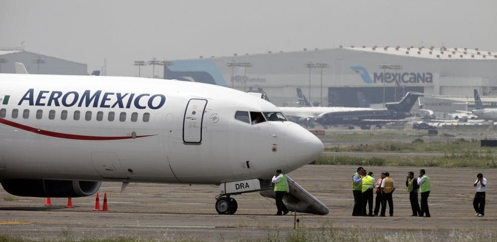 A hijacked Aeromexico plane sits on the tarmac at Mexico City's international airport on Wednesday. (AP)