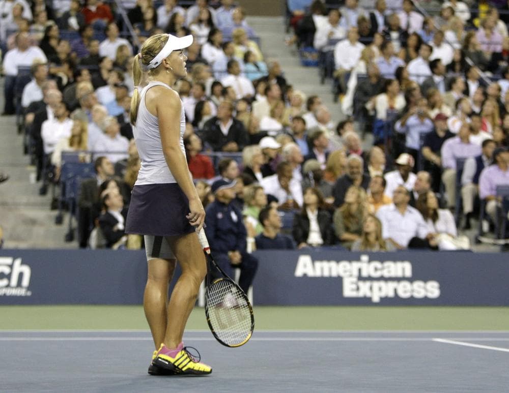 Melanie Oudin, in her signature shoes, pauses during her match against Caroline Wozniacki, of Denmark, at the U.S. Open tennis tournament in New York on Wednesday.