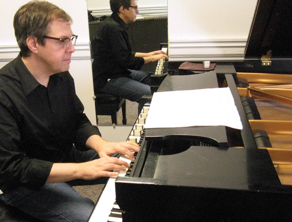 On his new CD, Bruce Brubaker used small metal weights, at left, to change the piano’s hue. The difference is very subtle, but Brubaker says it excites him because it's mysterious. (Andrea Shea/WBUR)