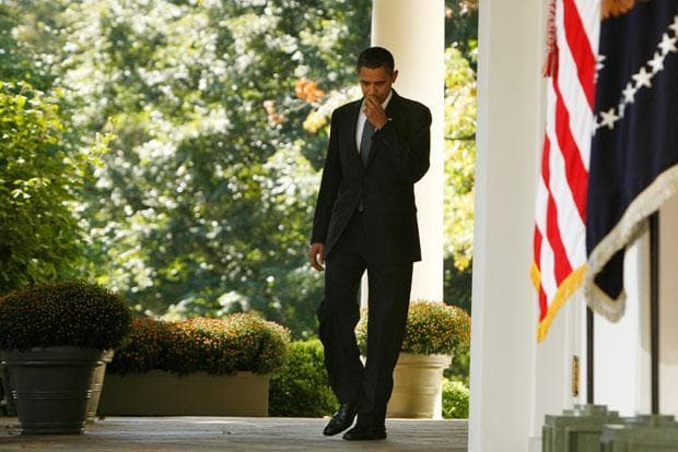 President Obama walks from the Oval Office to the Rose Garden to make remarks about being awarded the Nobel Peace Prize. (Gerald Herbert/AP)