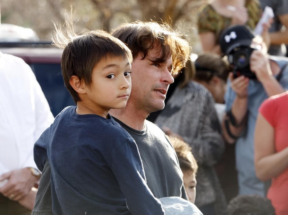 Six-year-old Falcon Heene with his father, Richard, outside the family's home in Fort Collins, Colo., after Falcon was found hiding in a box in a space above the garage on Thursday. (David Zalubowski/AP)