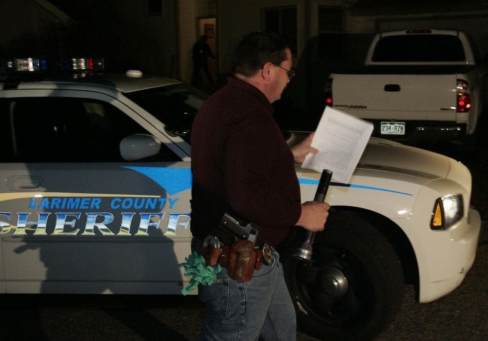 Larimer County Sheriff Department officers arrive to execute a search warrant on the Heene home Saturday in Fort Collins, Colo. (Will Powers/AP)