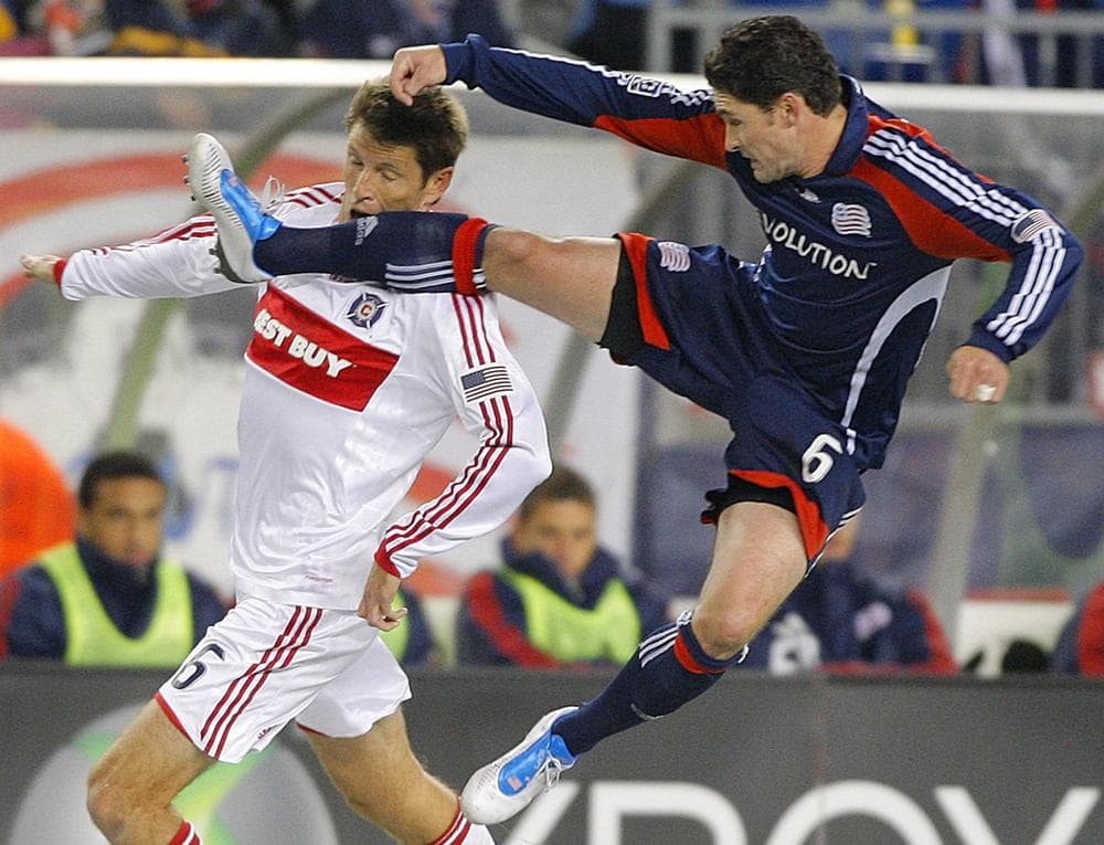 New England Revolution's Jay Heaps, right, kicks Chicago Fire defender Brandon Prideaux, left, in the face while leaping for a free ball during the first half of their MLS soccer match in Foxborough, Saturday night. (AP Photo/Stephan Savoia)