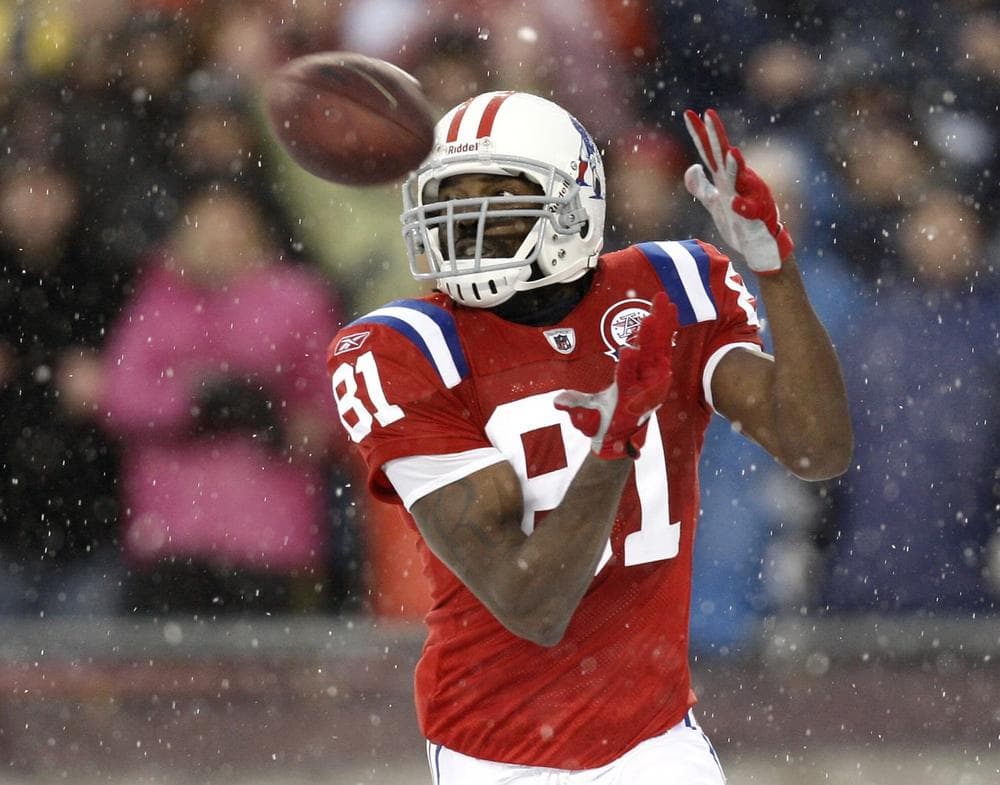 New England Patriots wide receiver Randy Moss catches a touchdown pass during the second quarter of an NFL football game against the Tennessee Titans at Gillette Stadium on Sunday, Oct. 18, 2009. (Winslow Townson/AP)