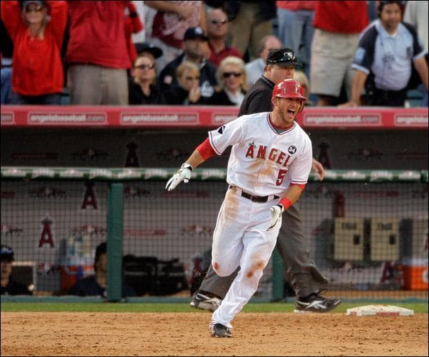 Los Angeles Angels' Jeff Mathis rounds first after hitting a double to beat the Yankees 5-4 in the eleventh inning of Game 3 of the American League Championship on Monday. (Jae C. Hong/AP)