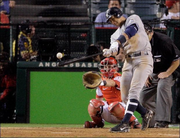 Alex Rodriguez hits a double in the 9th inning of Game 4 of the American League Championship series Tuesday. (Jae C. Hong/AP)