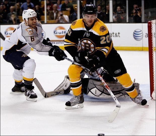 Boston Bruins' Daniel Paille goes for a rebound with Nashville Predators' Shea Weber during the second period on Wednesday. (Winslow Townson/AP)