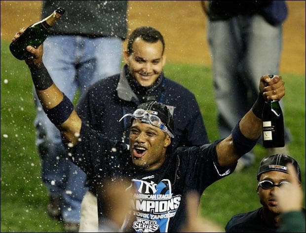 Robinson Cano celebrates with fans after winning Game 6 of the American League Championship baseball series. (Julie Jacobson/AP)