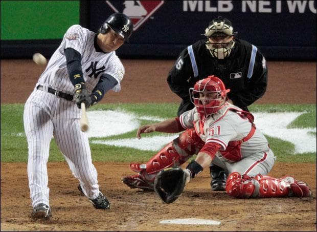 New York Yankees' Hideki Matsui hits a home run during the sixth inning of the World Series on Thursday. (Eric Gay/AP)