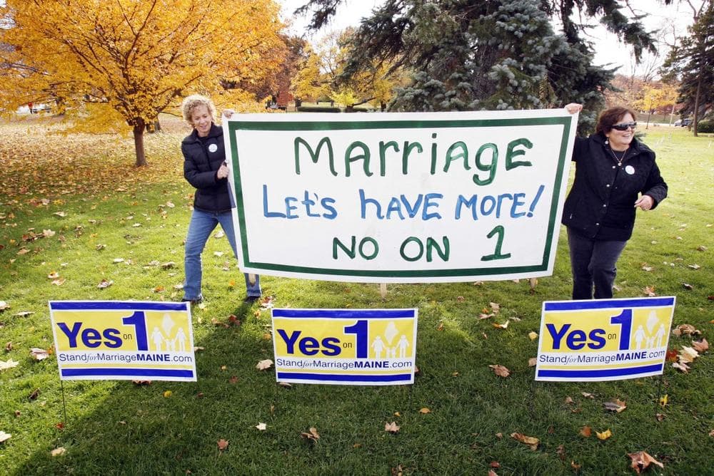 Supporters of same-sex marriage Suzanne Blackburn, left, and Ann DiMella, of Portland, Maine, prepare to set up a "No on 1" sign on Tuesday (Robert F. Bukaty/AP)