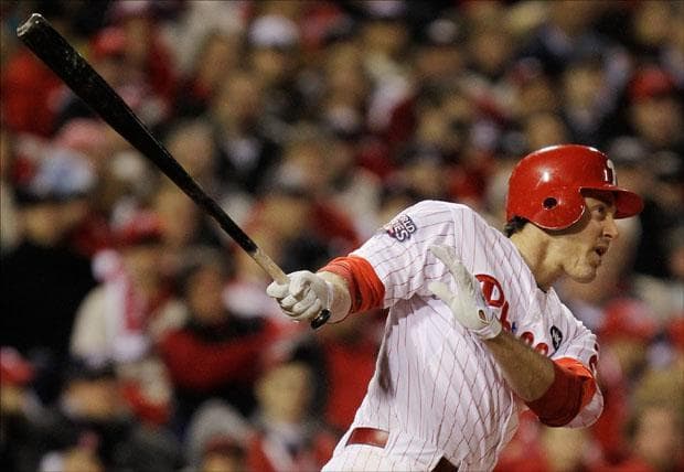 Chase Utley watches his home run against New York Yankees' Phil Coke during the seventh inning of Game 5 of the World Series on Monday. (David J. Phillip/AP)