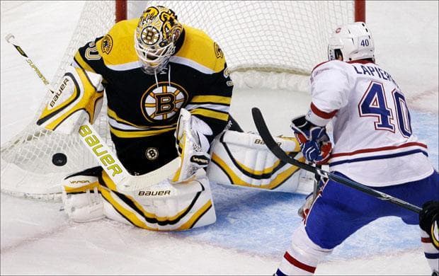 Goalie Tim Thomas makes a save on a shot by Montreal Canadiens center Maxim Lapierre in the first period on Thursday. (Charles Krupa/AP)