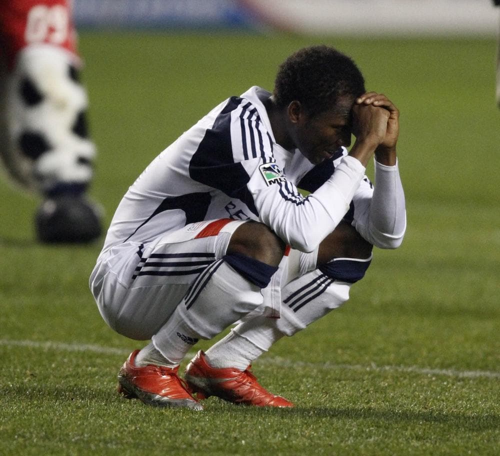 New England Revolution's Sainey Nyassi reacts to the Chicago Fire's 2-0 victory Saturday, in Bridgeview, Ill. (AP Photo/Jim Prisching)