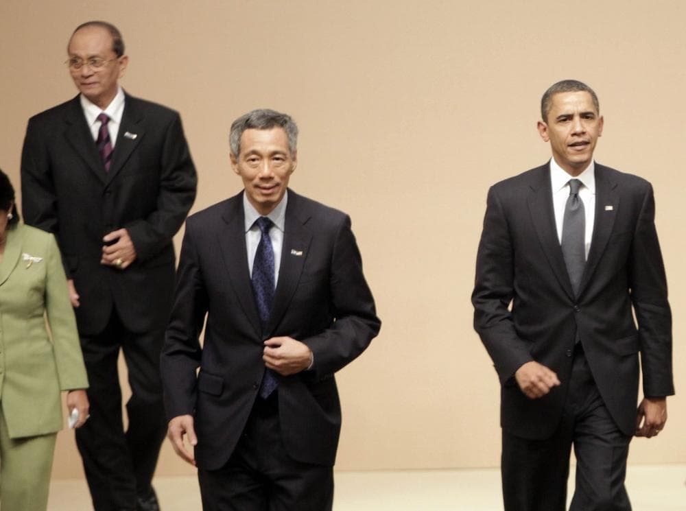 From left to right, Myanmar's Prime Minister Gen. Thein Sein, Singaporean Prime Minister Lee Hsien Loong and U.S. President Barack Obama, prepare to take their seats for a multilateral meeting with ASEAN-10 members in Singapore, Sunday. (AP Photo/Pablo Martinez Monsivais)