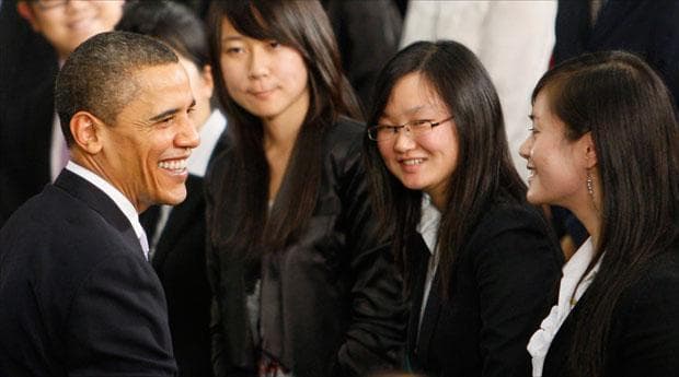 President Obama greets students after he spoke at a town hall style event with Chinese youth at the Museum of Science and Technology in Shanghai. (Charles Dharapak/AP)
