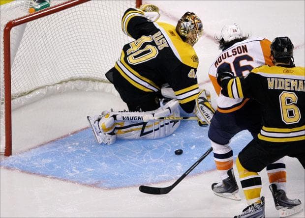 Goalie Tuukka Rask and New York Islanders left wing Matt Moulson watch a goal by Islanders' John Tavares during the third period on Monday. (Charles Krupa/AP)