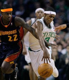 Guard Rajon Rondo controls the ball against Golden State Warriors guard Anthony Morrow on Wednesday. (Elise Amendola/AP)