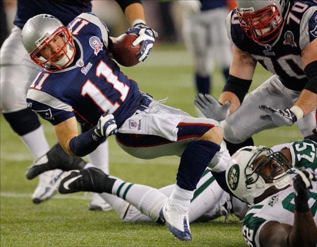 Patriots wide receiver Julian Edelman spins for yardage after a catch during the fourth quarter on Sunday. (Stephan Savoia/AP)