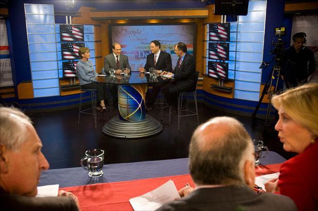 Attorney General Martha Coakley, Rep. Michael Capuano, Celtics co-owner Stephen Pagliuca and City Year co-founder Alan Khazei. prepare for their last broadcast debate on Wednesday. The panelists are, from lower left, Boston Globe reporter Frank Phillips, WBUR anchor Bob Oakes, and WGBH host Emily Rooney. (Pool photo by Dina Rudick via AP)
