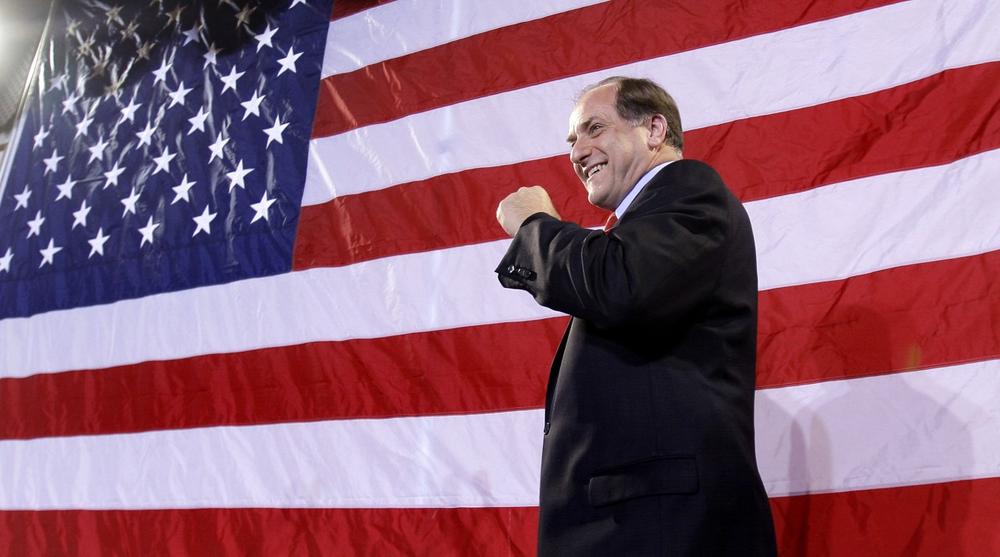 Capuano pumps his fist as supporters clap. (AP)