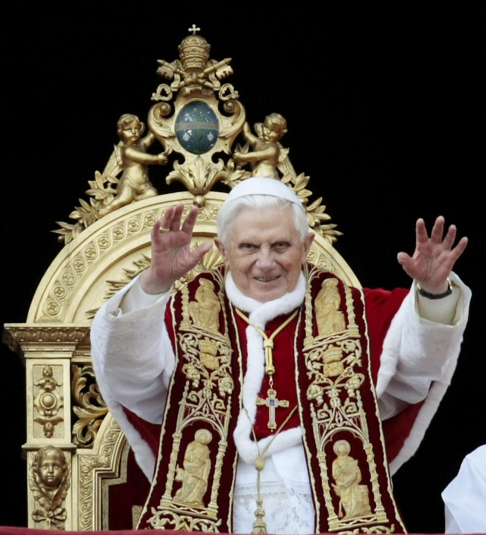 Pope Benedict XVI waves to faithful during the "Urbi et Orbi" (to the City and to the World) message in St. Peter's square at the Vatican, Friday, Dec. 25, 2009. (AP)