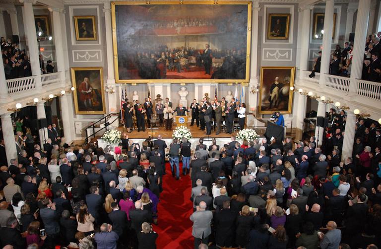 Boston Mayor Thomas M. Menino quiets the audience during his inaugural address Monday at Faneuil Hall. (Andrew Phelps/WBUR)