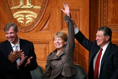 Vanquished Democratic Senate candidate, Attorney General Martha Coakley, received a standing ovation while state Auditor Joseph DeNucci held her hand aloft. At left, Secretary of State William Galvin. (AP)