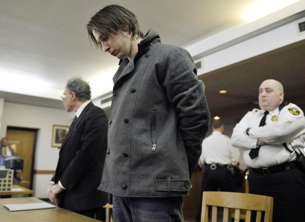 Anthony Baye stands next to his attorney, Alan Rubin, left, in Hampshire District Court in Northampton on Tuesday to face arraignment on murder and arson charges. (AP)