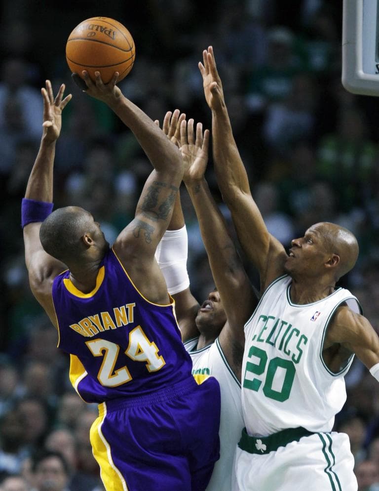 Los Angeles Lakers' Kobe Bryant (24) shoots over Boston Celtics' Ray Allen (20) and Glen Davis in the fourth quarter of Sunday's game. (AP Photo/Michael Dwyer)