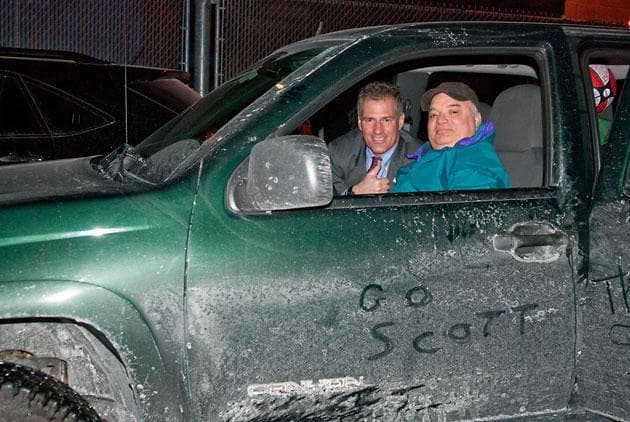 Sen.-elect Scott Brown (left) with WBUR's Bob Oakes in Worcester on Saturday in the now-famous pickup truck. (Jennifer Donaldson/WBUR) 