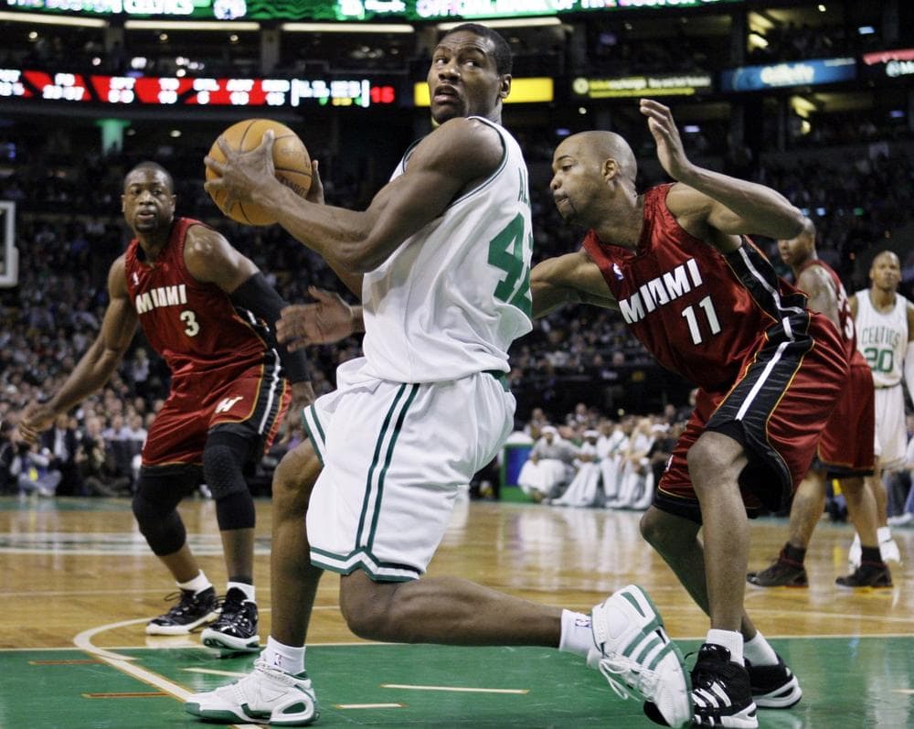 Boston Celtics guard Tony Allen (42) looks to make a move against the defense of Miami Heat guard Rafer Alston (11) as Heat guard Dwyane Wade (3) looks on in the second half of Wednesday's game. (AP Photo/Elise Amendola)