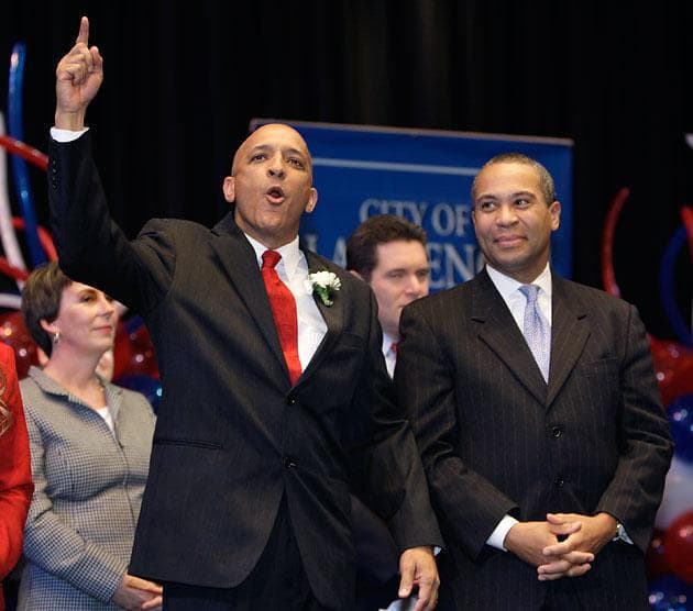 Lawrence Mayor and state Rep. William "Willy" Lantigua, left, with Mass. Gov. Deval Patrick during his inauguration ceremony Jan. 4, 2010. (Charles Krupa/AP)