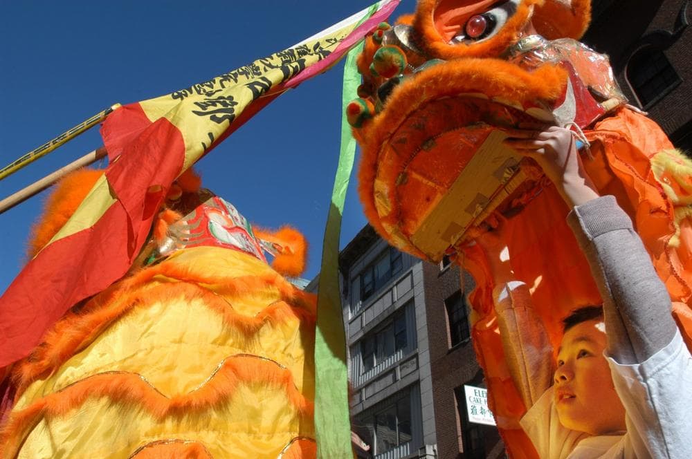 Win King Hu, 8, of Boston, performs a lion dance during a Lunar New Year celebration in Boston's Chinatown in 2004. (AP)