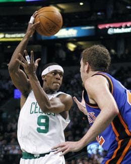 Boston Celtics' Rajon Rondo (9) passes past New York Knicks' David Lee in the third quarter of Tuesday's game. (AP Photo)