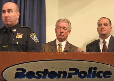 Boston Police Superintendent in Chief Dan Linskey, left, Det. Steve Blair and Jay Walsh, director of the Office of Neighborhood Services, appear at the safety seminar in Roxbury on Thursday. (Brent Baughman/WBUR)