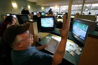 The old Raynham race track has not seen much action since the end of 2009, when this photograph was taken, now that Greyhound dog racing is illegal in Massachusetts. The track could thrive again if it gets hundreds, maybe thousands, of slots machines. (Steven Senne/AP)