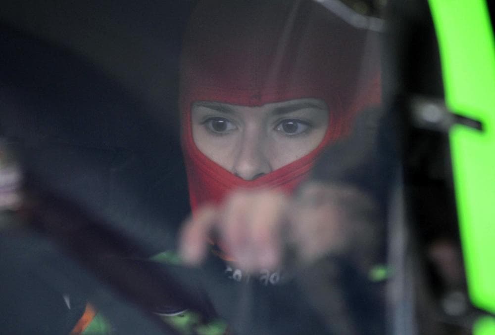 It's a man, no, it's a woman — it's Danica Patrick — in the seat of her GoDaddy.com Chevrolet on Feb. 19. (Walt Weis/AP)