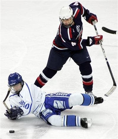 USA's Angela Ruggiero (standing) in a game in December 2005. (Tim Larsen/AP)