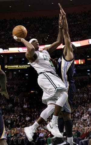 Celtics guard Rajon Rondo shoots against Grizzlies guard Mike Conley during Wednesday's game in Boston. (AP)